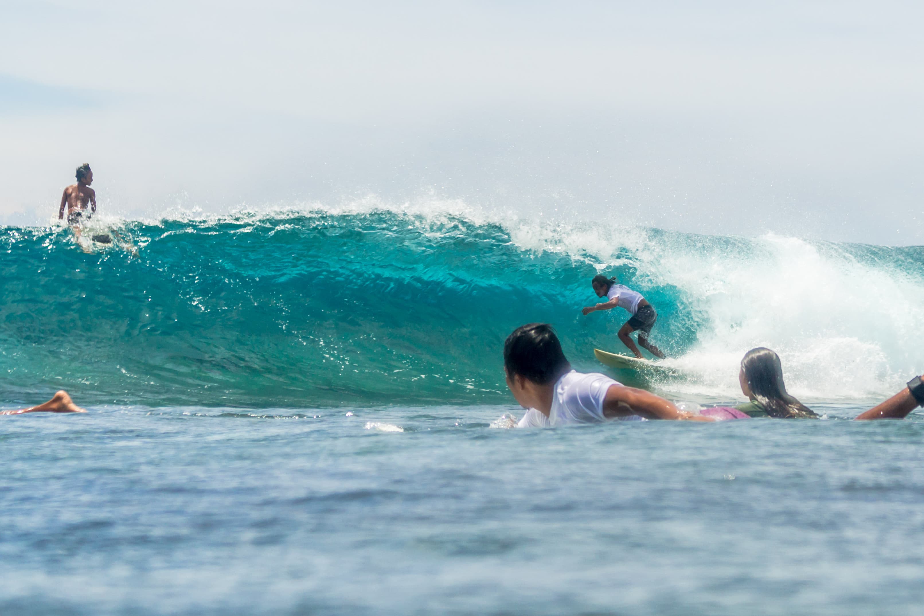 Surfer catches a small barrel at Quicksilver in Siargao