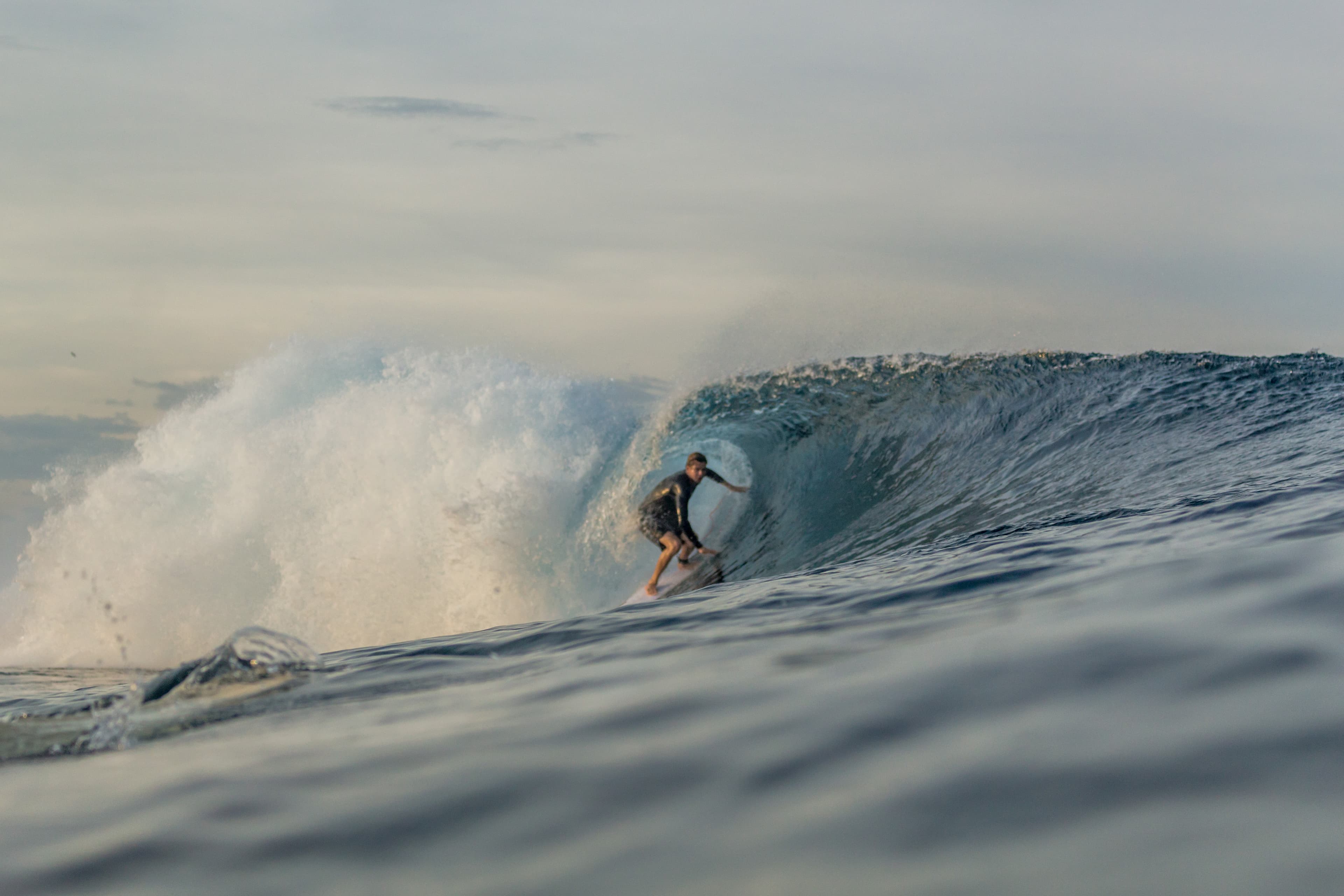 Surfer getting barelled at Tuason in Siargao, Philippines.